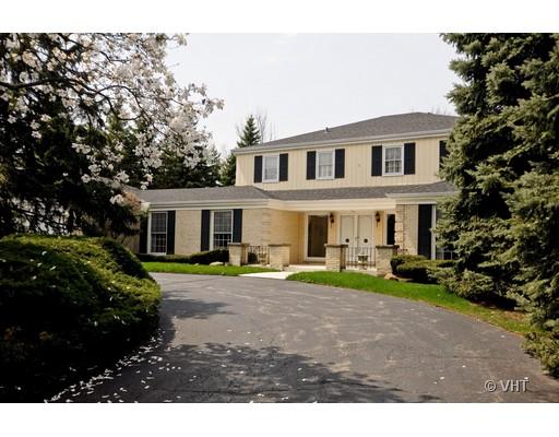 a view of house with outdoor space and garden