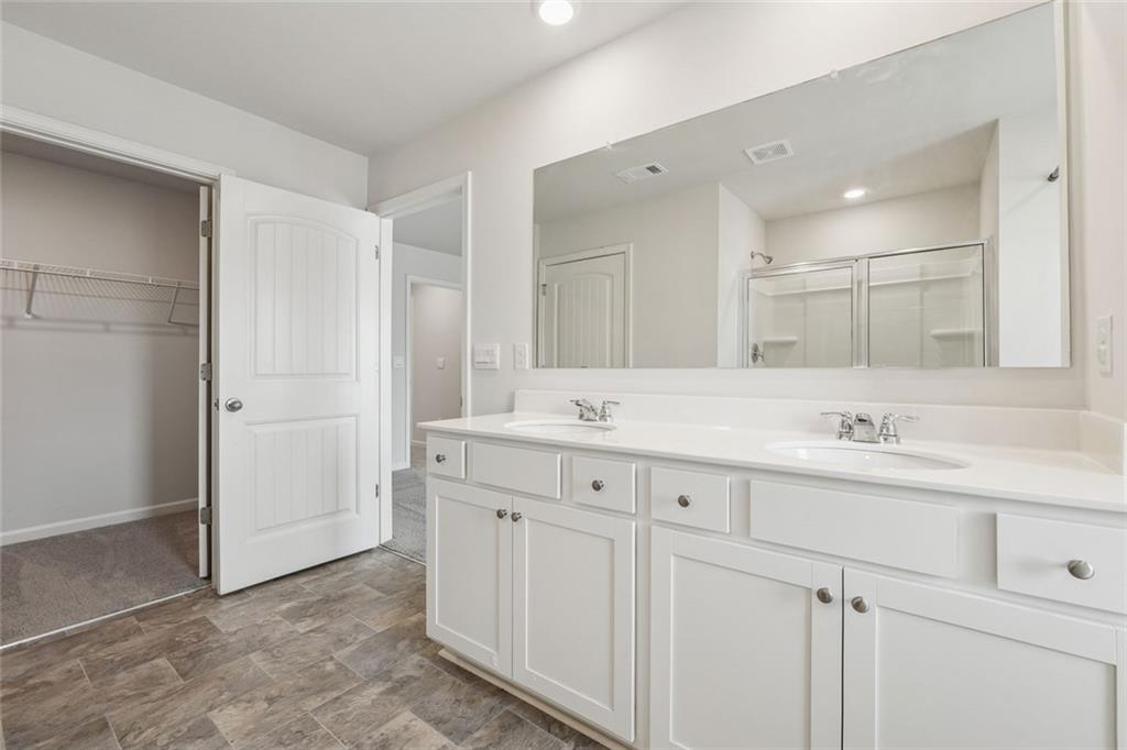 96 Quail Bend Way Dallas, GA 30157 - Photo 25 of 57 a bathroom with a sink and a mirror