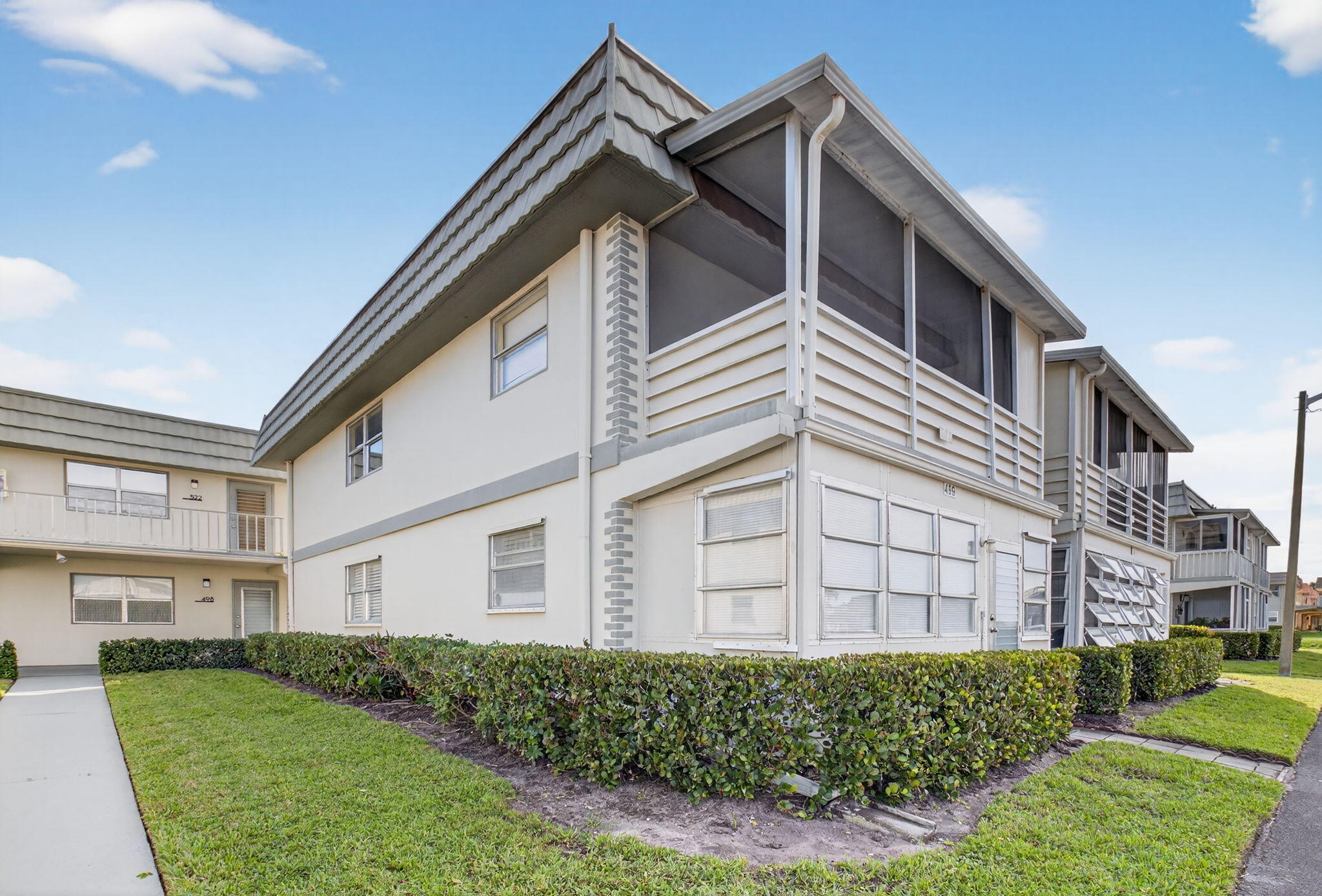 499 Monaco Way, Unit K Delray Beach, FL 33446 - Photo 17 of 33 a view of a house with a yard