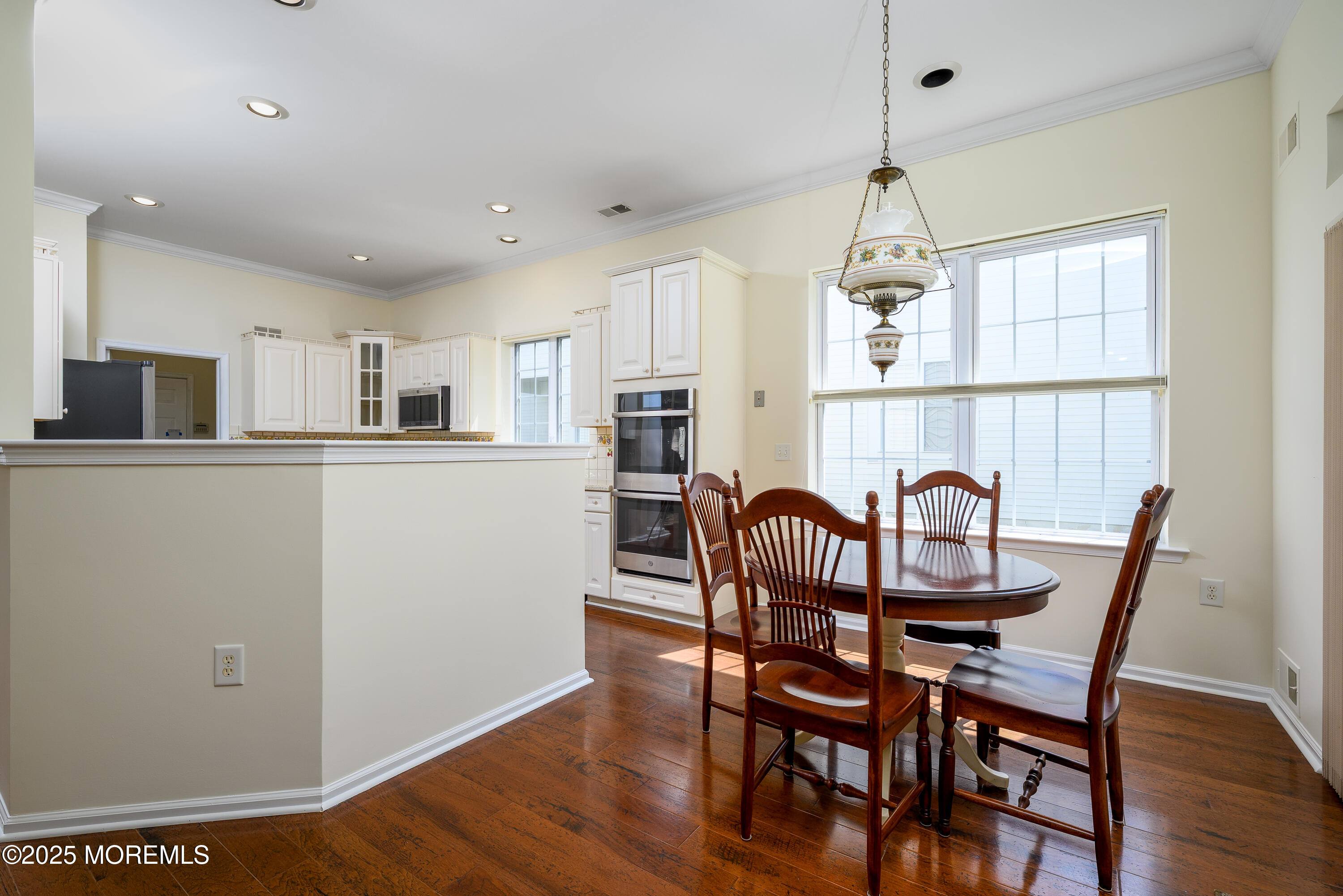 38 Strathmere Street Waretown, NJ 08758 - Photo 14 of 50 a view of a dining room with furniture window and wooden floor