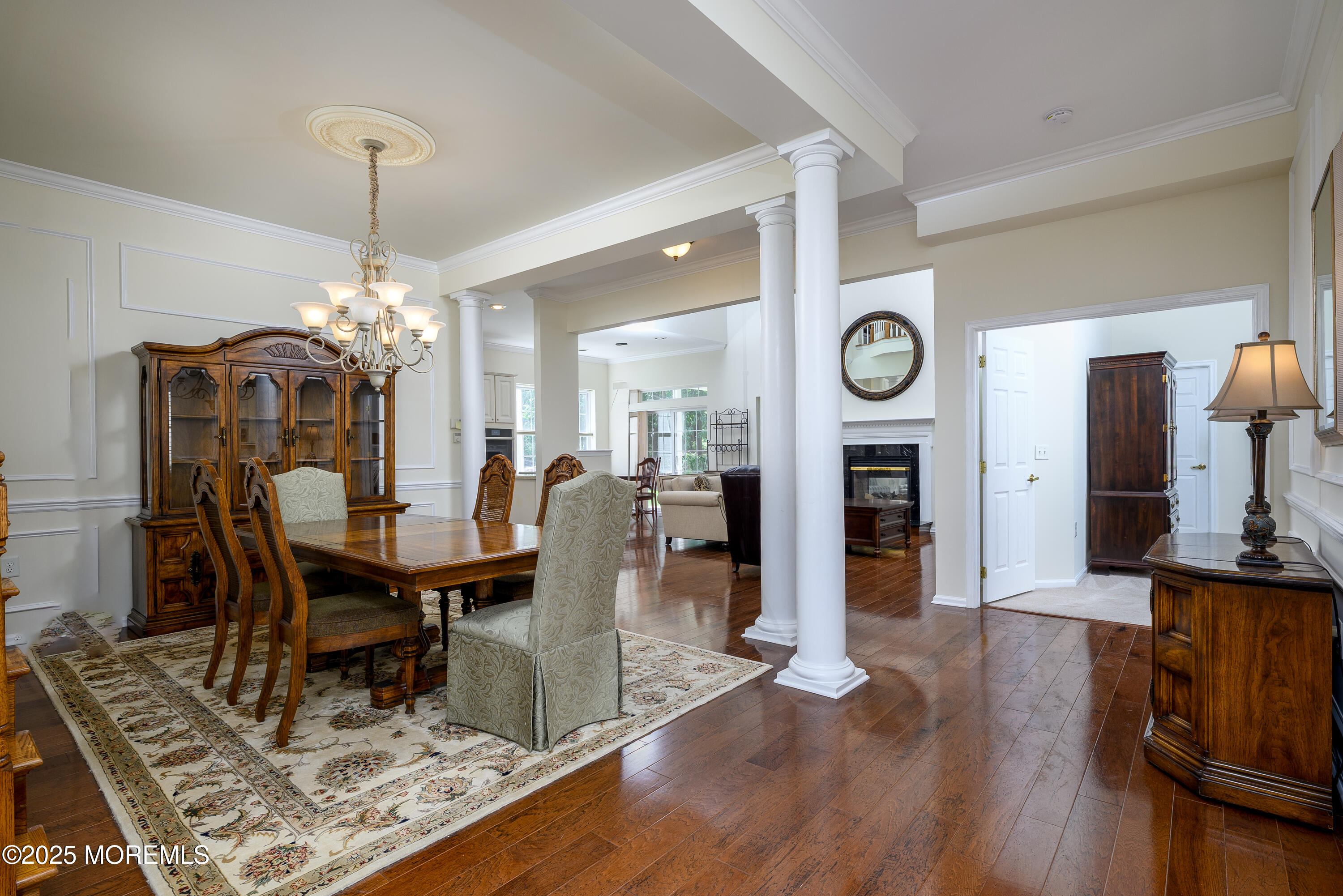 38 Strathmere Street Waretown, NJ 08758 - Photo 6 of 50 a view of a dining room with furniture and wooden floor