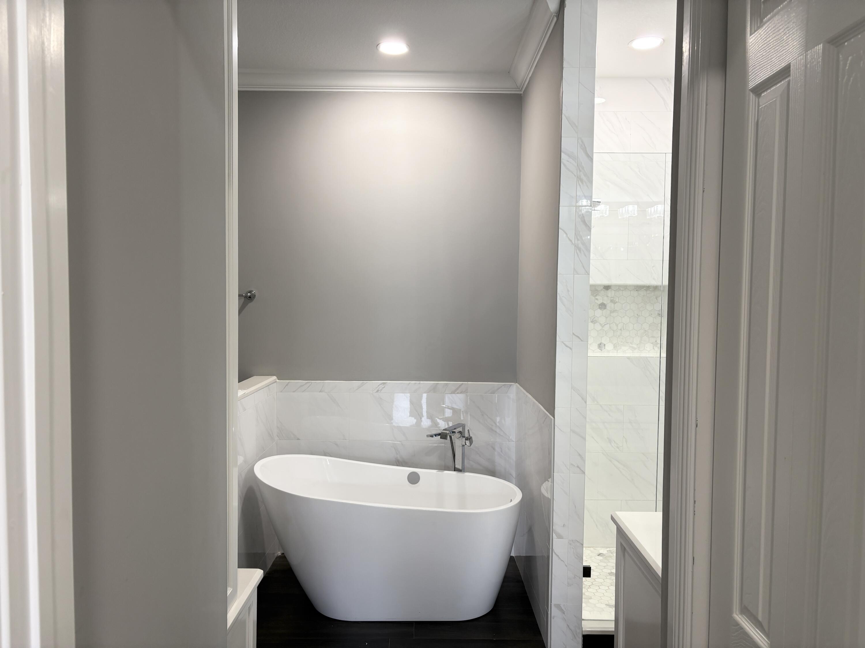 10560 Southwest Stephanie Way, Unit 1202 Port St. Lucie, FL 34987 - Photo 11 of 19 a bathroom with a sink and a mirror