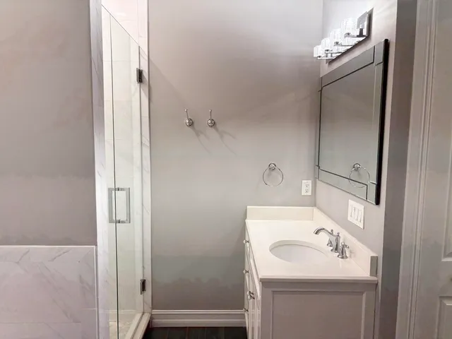 a bathroom with a sink and a mirror