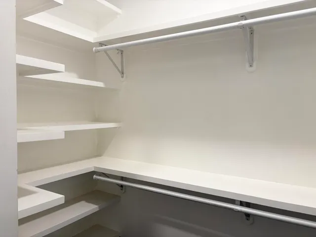 a view of an empty walk in closet