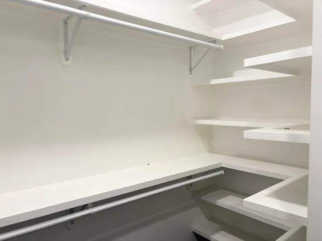 a view of an empty walk in closet