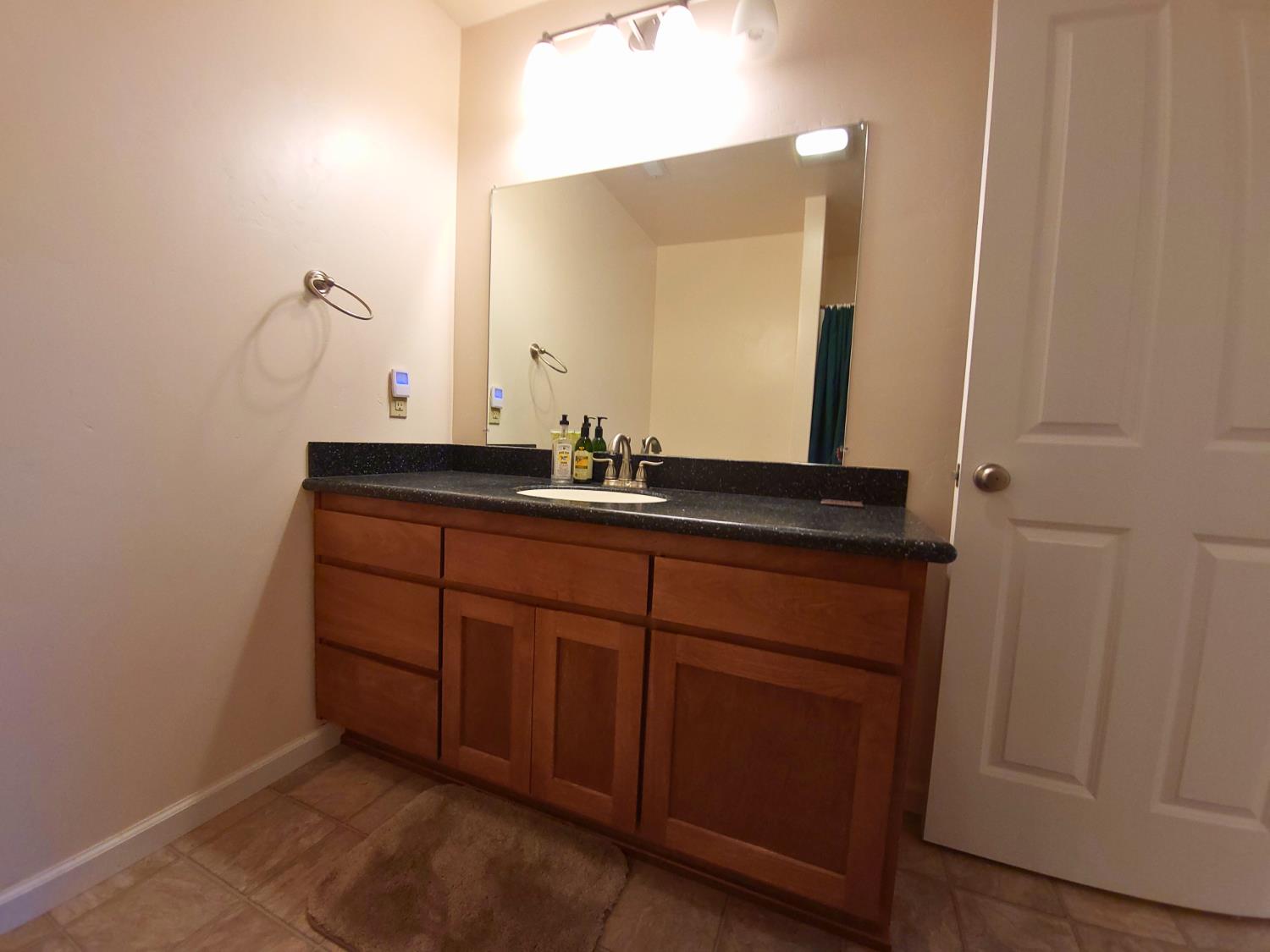 2733 Emco Road Rail Road Flat, CA 95248 - Photo 21 of 41 a bathroom with a sink and a mirror