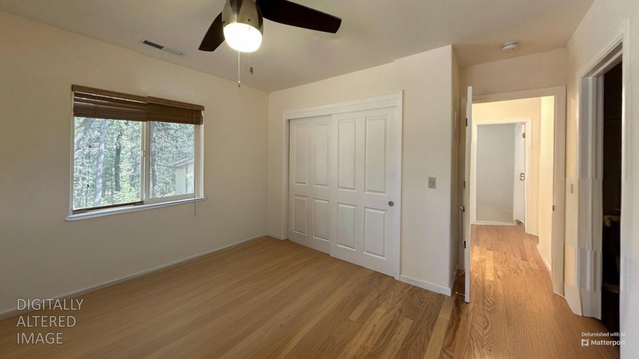 2733 Emco Road Rail Road Flat, CA 95248 - Photo 28 of 41 a view of an empty room with wooden floor and a window