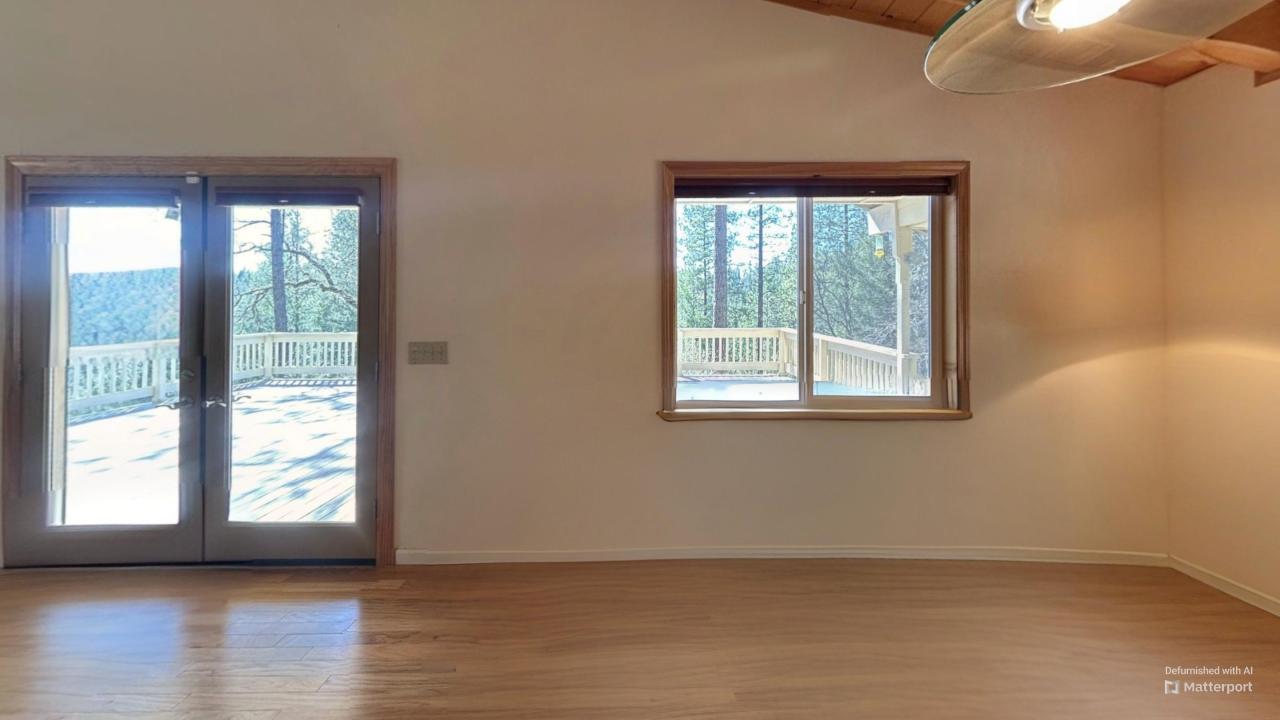 2733 Emco Road Rail Road Flat, CA 95248 - Photo 30 of 41 a view of an empty room with wooden floor and a window