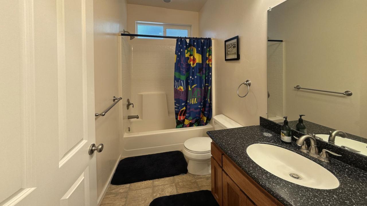 2733 Emco Road Rail Road Flat, CA 95248 - Photo 32 of 41 a bathroom with a granite countertop sink toilet and shower