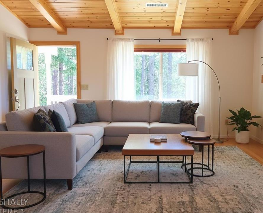 2733 Emco Road Rail Road Flat, CA 95248 - Photo 9 of 41 a living room with furniture and a large window