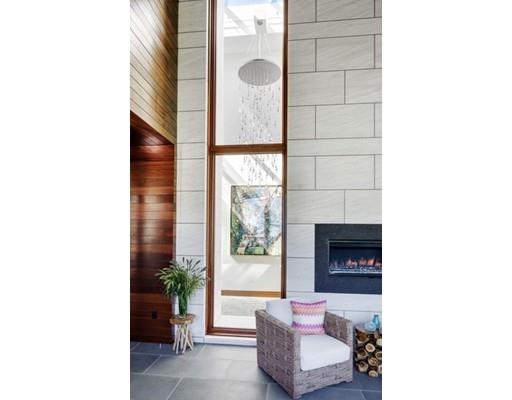 9 Sumner Lane Belmont, MA 02478 - Photo 22 of 29 a living room with furniture and a fireplace