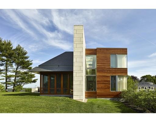 9 Sumner Lane Belmont, MA 02478 - Photo 24 of 29 a front view of a house with a yard