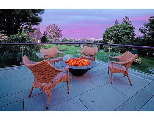 9 Sumner Lane Belmont, MA 02478 - Photo 25 of 29 a backyard of a house with wooden floor and outdoor seating