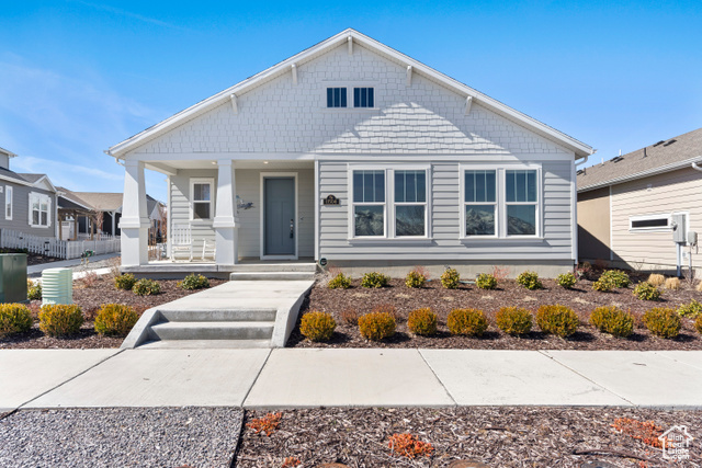 Bungalow-style home with a porch