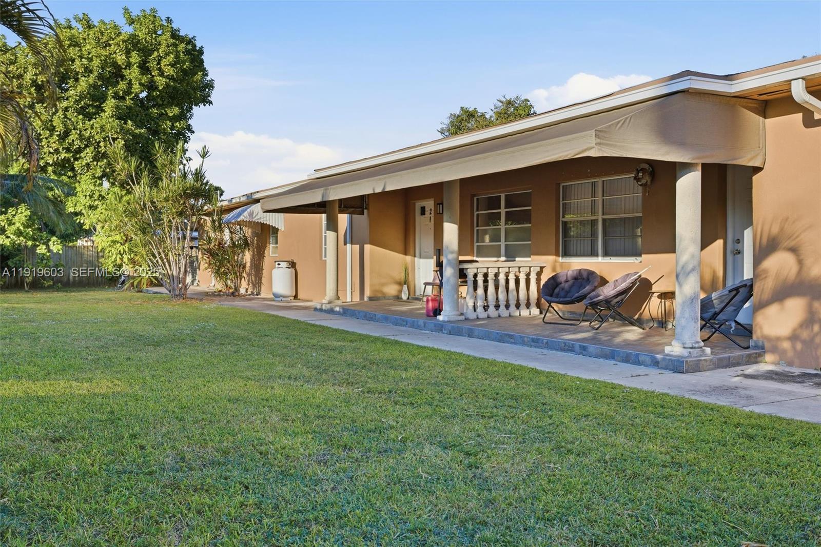 a front view of a house with garden