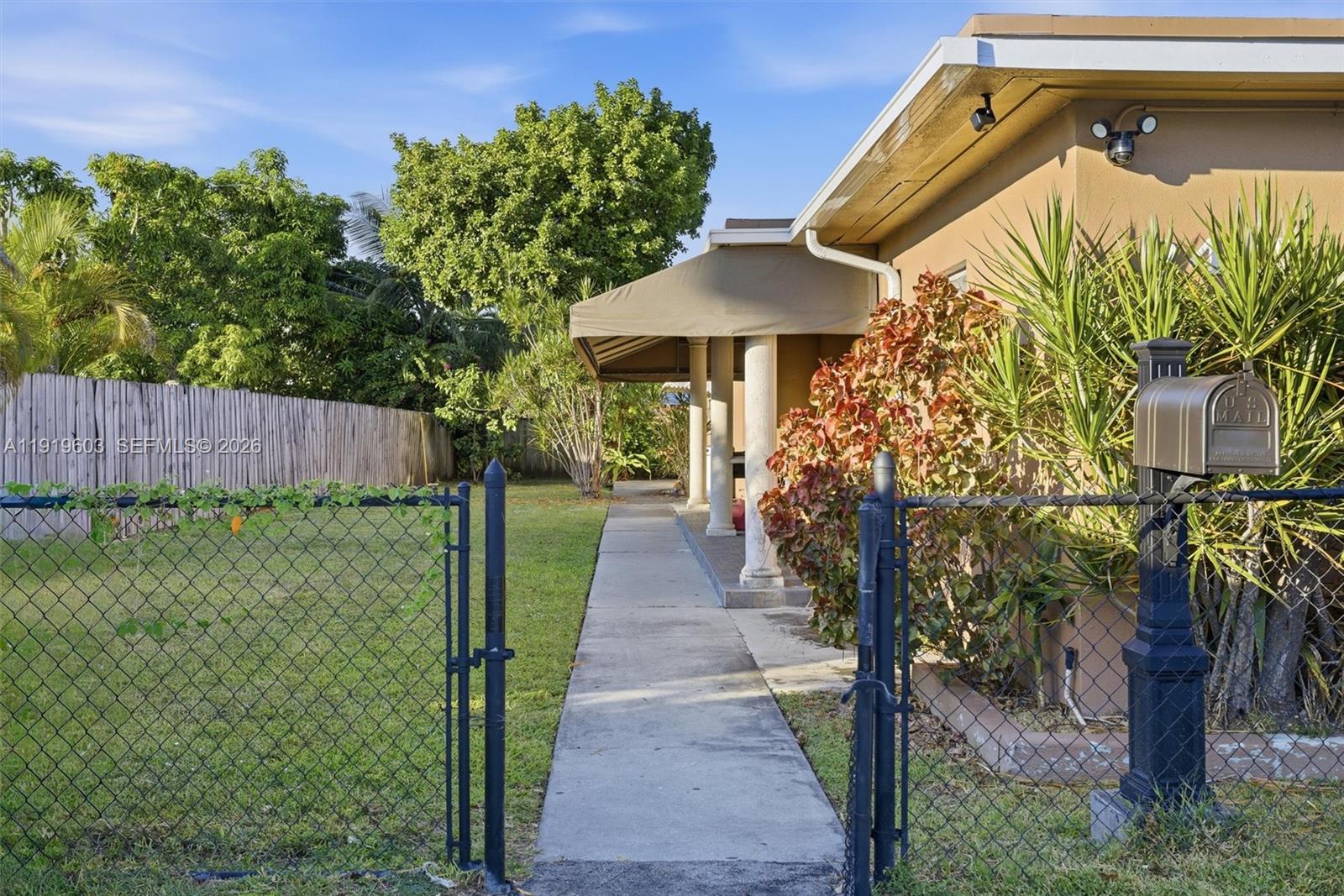 2445 Southwest 18th Street, Unit 3 Miami, FL 33145 - Photo 4 of 18 a front view of a house with garden