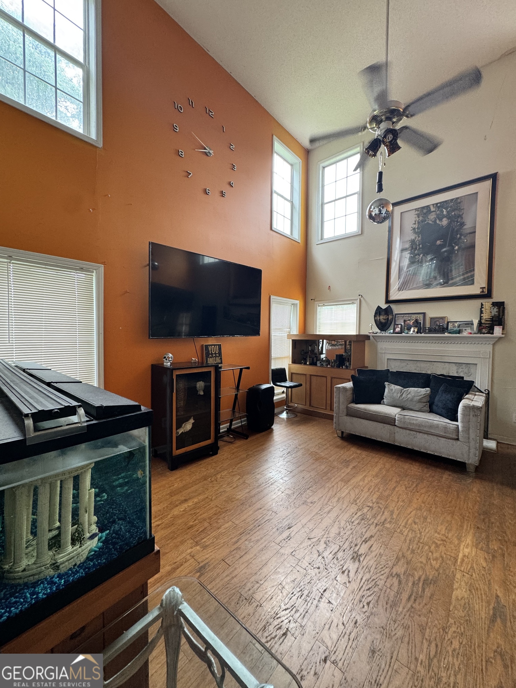 2487 Courtney Renea Drive Dacula, GA 30019 - Photo 11 of 16 a living room with furniture and a flat screen tv
