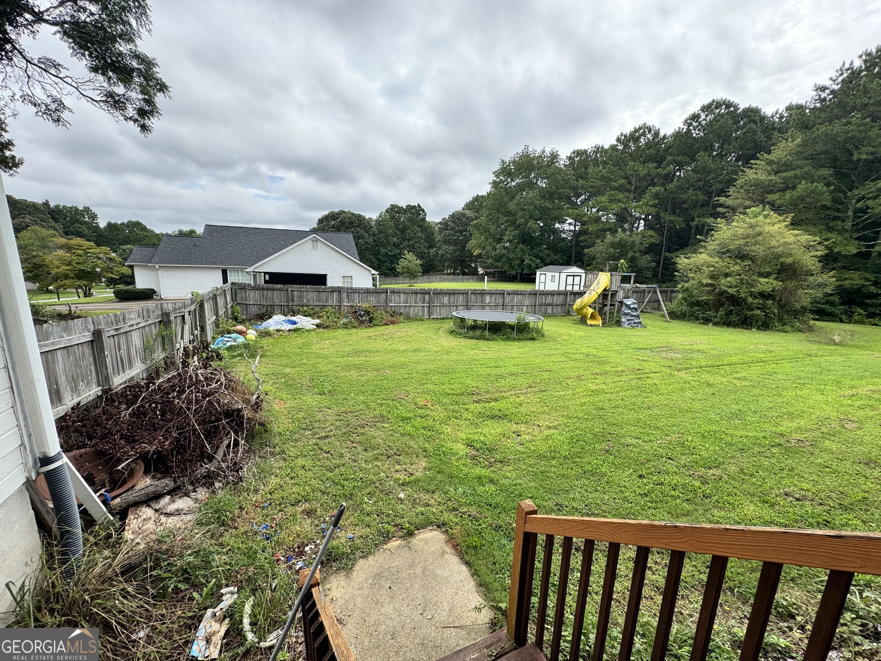 2487 Courtney Renea Drive Dacula, GA 30019 - Photo 12 of 16 a view of a garden with an outdoor space