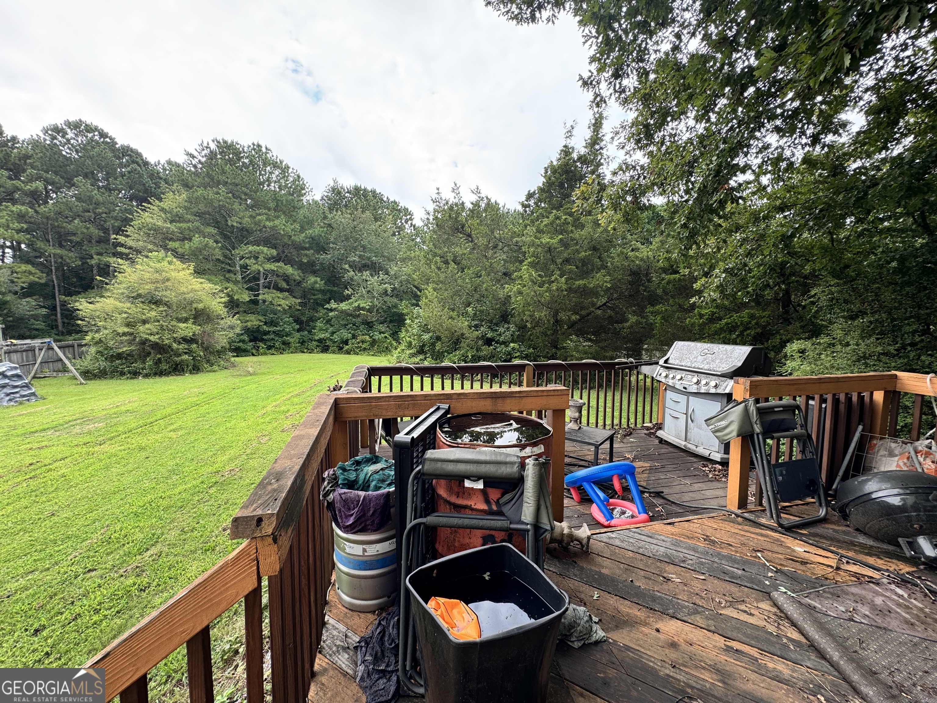 2487 Courtney Renea Drive Dacula, GA 30019 - Photo 14 of 16 a view of a wooden deck and a backyard