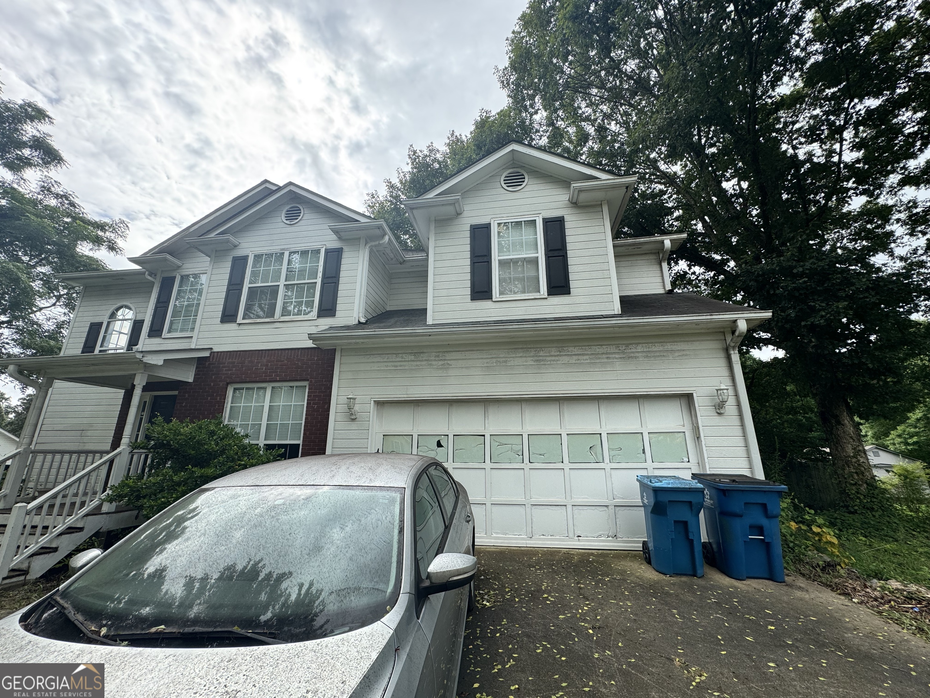 2487 Courtney Renea Drive Dacula, GA 30019 - Photo 3 of 16 a view of a house with a yard and large tree