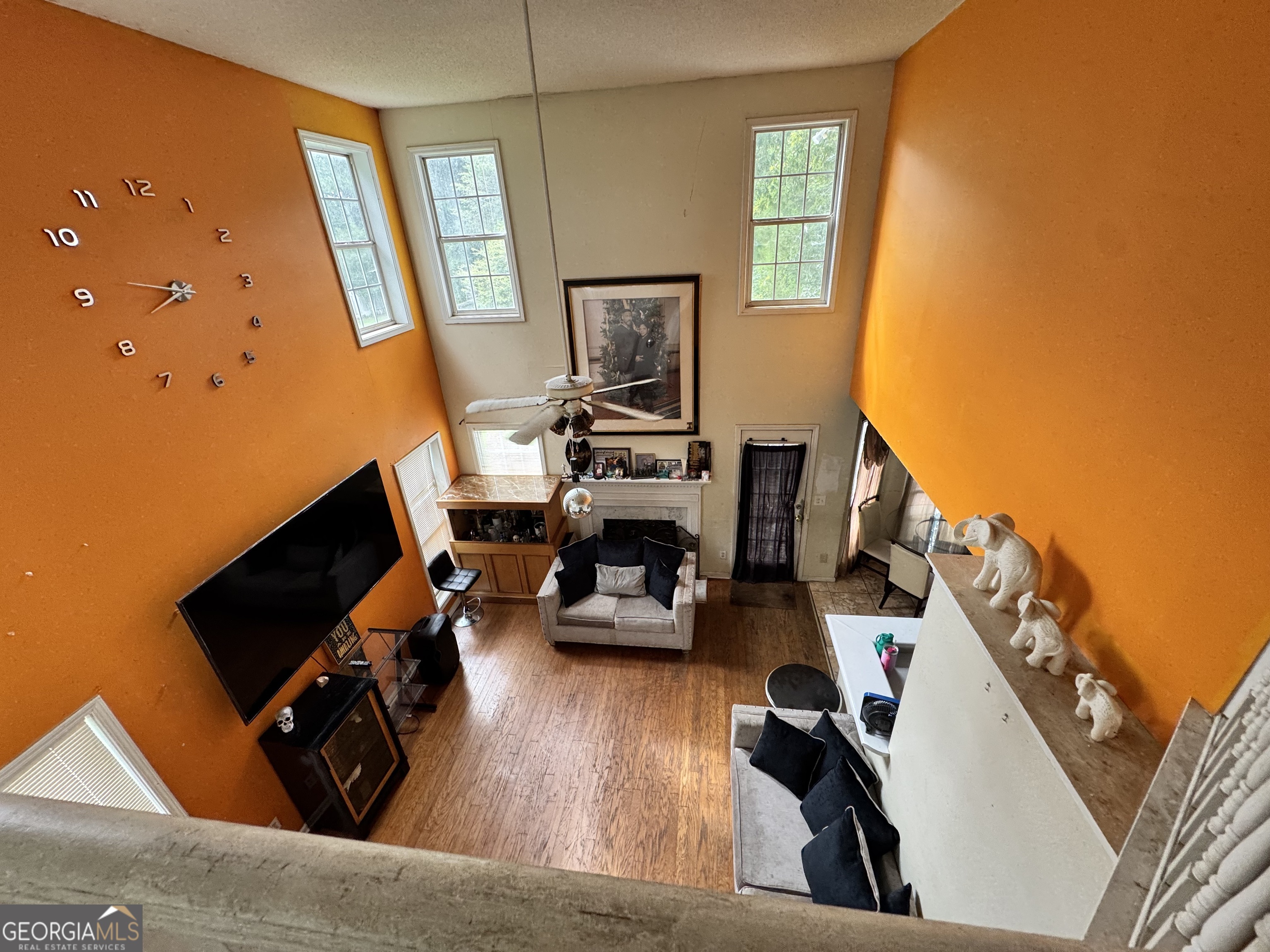 2487 Courtney Renea Drive Dacula, GA 30019 - Photo 5 of 16 a living room with furniture and a flat screen tv