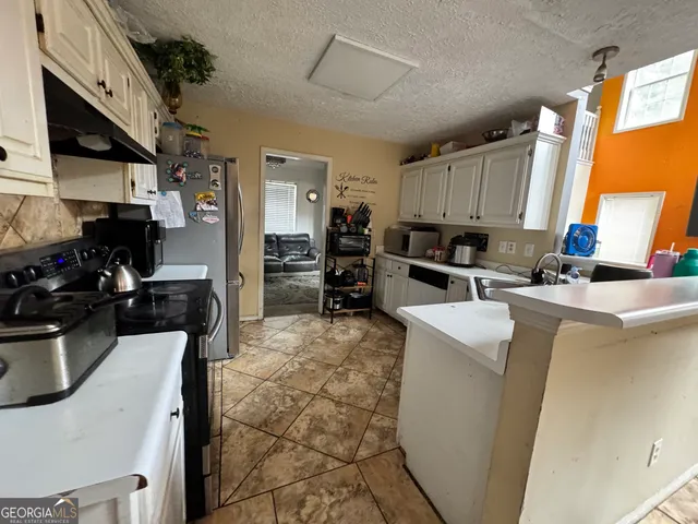 a view of a livingroom with furniture window and wooden floor