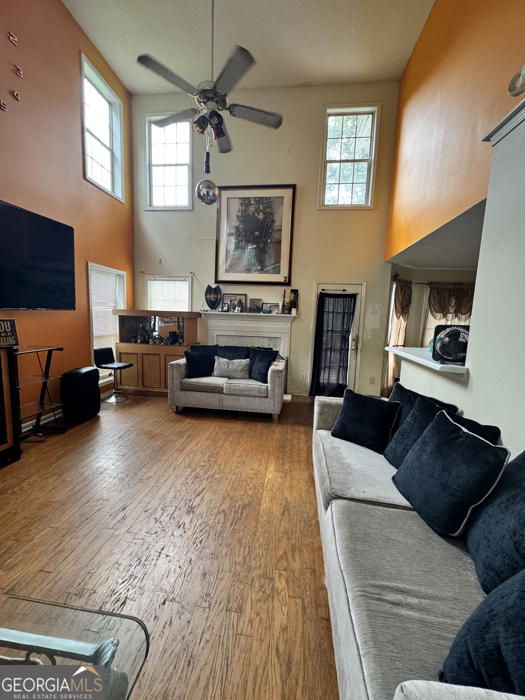 2487 Courtney Renea Drive Dacula, GA 30019 - Photo 10 of 16 a living room with furniture and a flat screen tv
