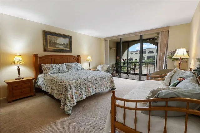 a bedroom with a bed a window and dresser