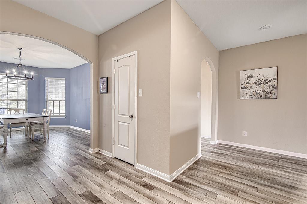 1813 Rialto Lane Crowley, TX 76036 - Photo 10 of 27 a view of a room with wooden floor and furniture