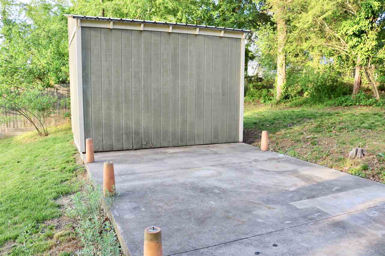 1500 North King Charles Road Raleigh, NC 27610 - Photo 29 of 30 Rear view of Shed with large patio and foundation tabs for further development. Storage Shed