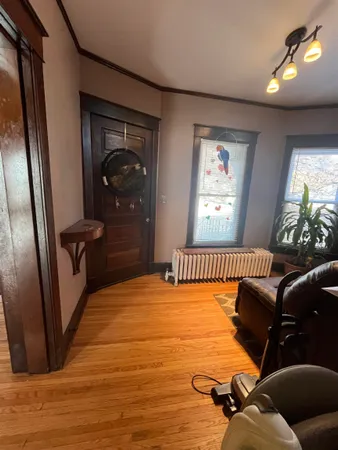 a bedroom with furniture and a window