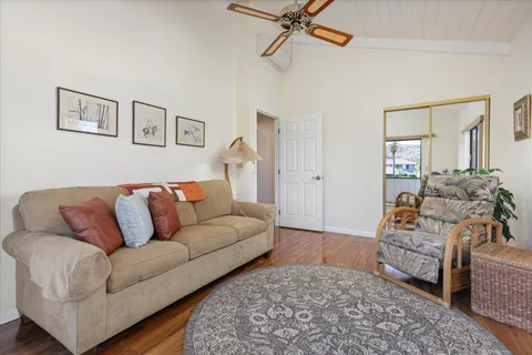 a large bedroom with a bed and a window