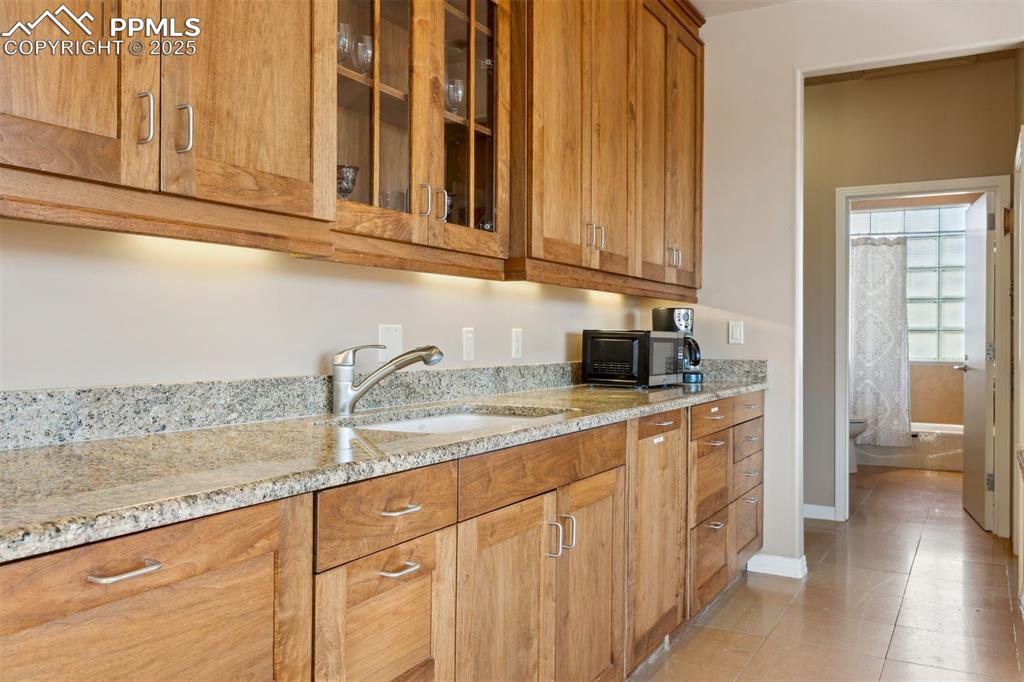 99 Bradburn Road Cotopaxi, CO 81223 - Photo 46 of 49 a kitchen with stainless steel appliances granite countertop a sink a stove and cabinets