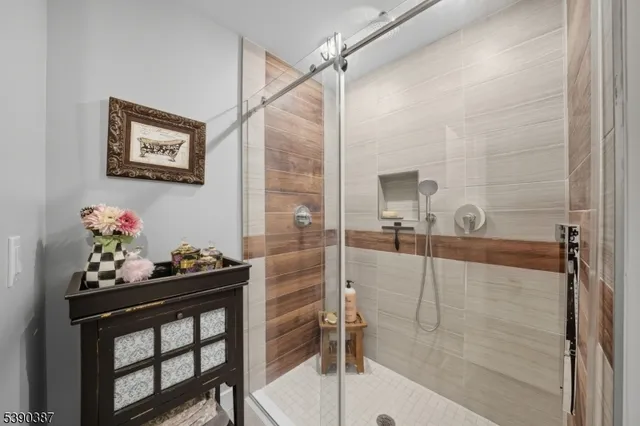 a bathroom with a tub sink and mirror