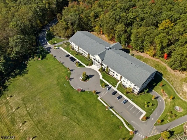 an aerial view of a house with a garden