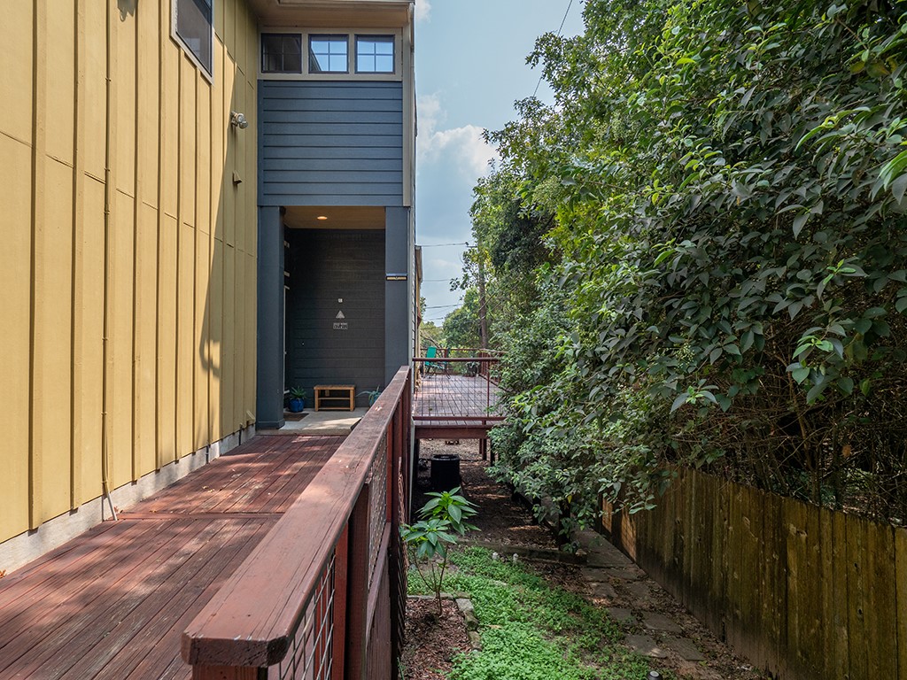 3609 Clawson Road, Unit B Austin, TX 78704 - Photo 28 of 28 Exterior featuring a wood-finish ramp, an entry alcove, and a privacy fence