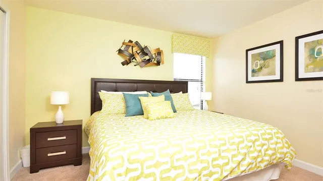 a bedroom with a bed and a desk