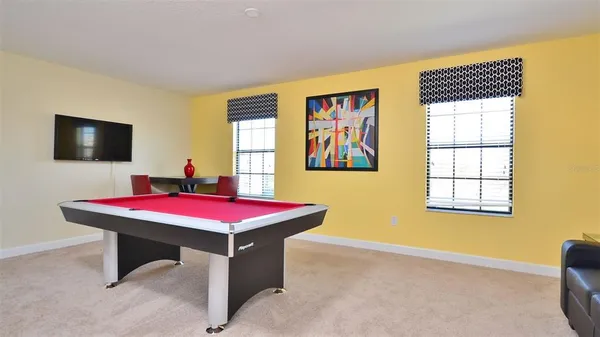 a view of a dining room with furniture and window