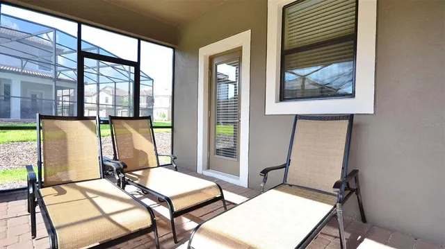 a living room with fireplace furniture and a chandelier