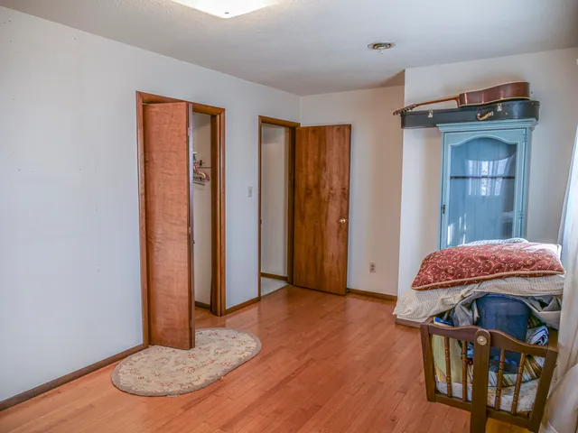 a view of a livingroom with furniture and hardwood floor