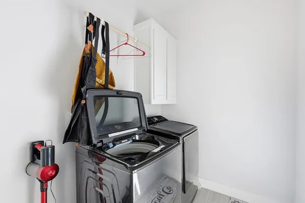 a view of storage and utility room with sink