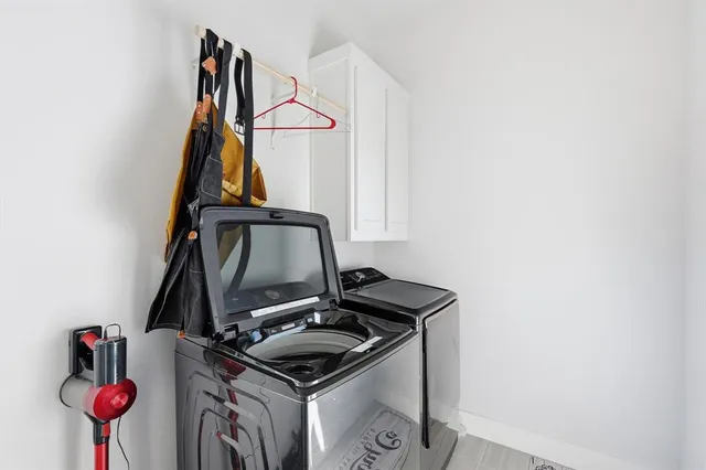 a view of storage and utility room with sink
