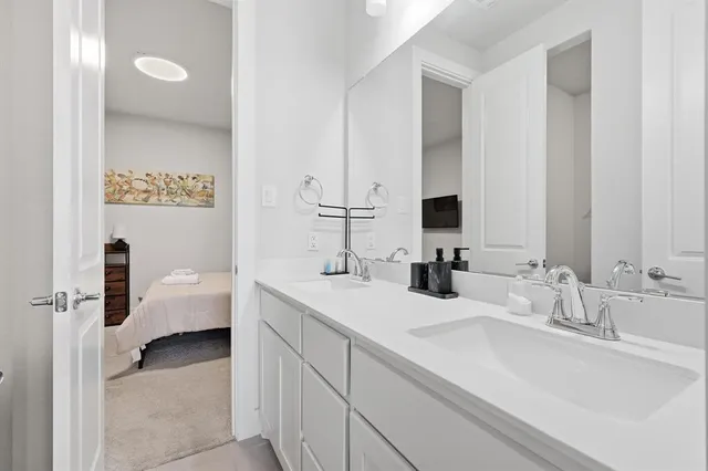 a bathroom with a sink and a mirror