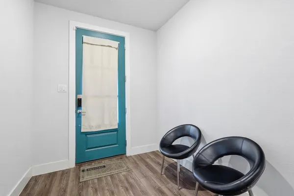 a room with a chair and a window