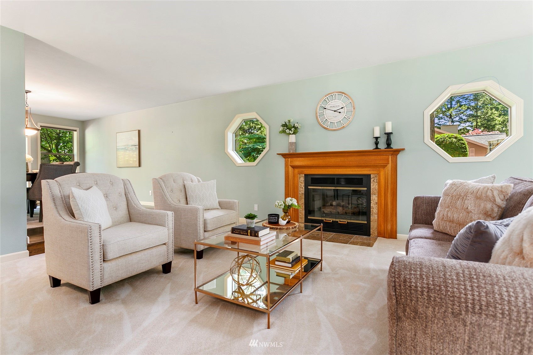 349 Viewcrest Road Bellingham, WA 98229 - Photo 20 of 36 a living room with furniture a clock and a fireplace