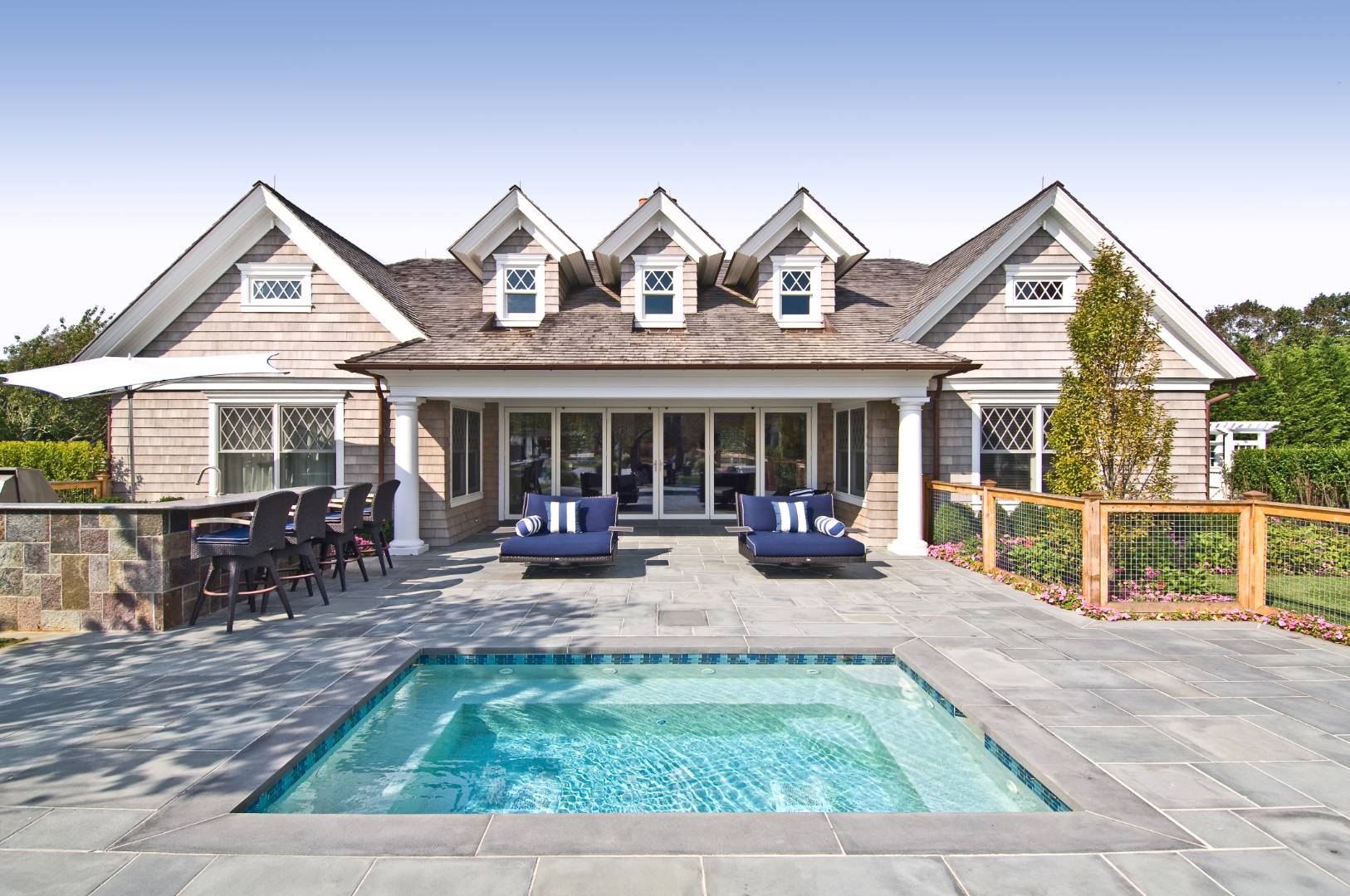 612 Halsey Lane Bridgehampton, NY 11932 - Photo 27 of 31 a view of a house with a small yard and sitting area