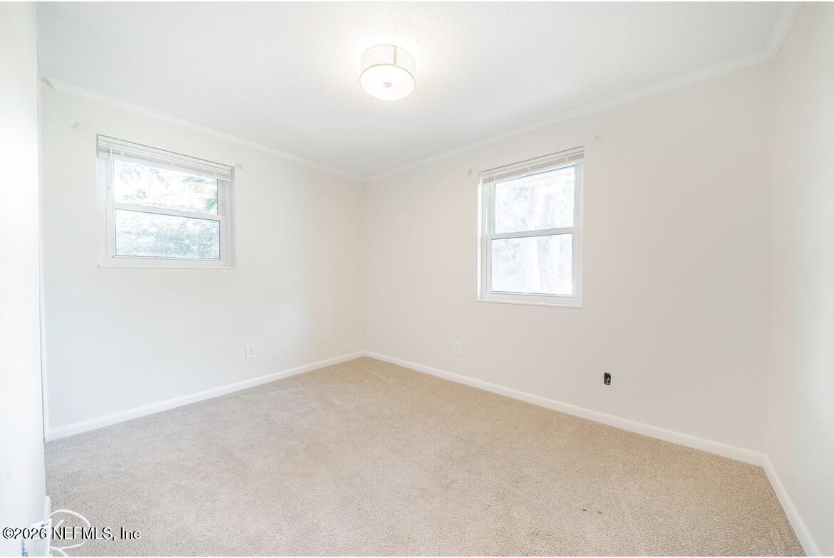 7762 Knoll Drive South Jacksonville, FL 32221 - Photo 17 of 22 an empty room with a window