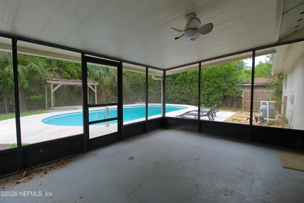 a view of an empty room with windows