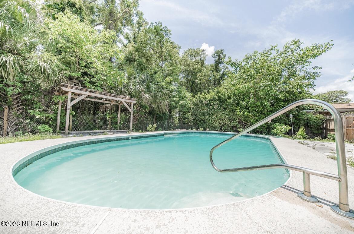 7762 Knoll Drive South Jacksonville, FL 32221 - Photo 21 of 22 a view of a swimming pool