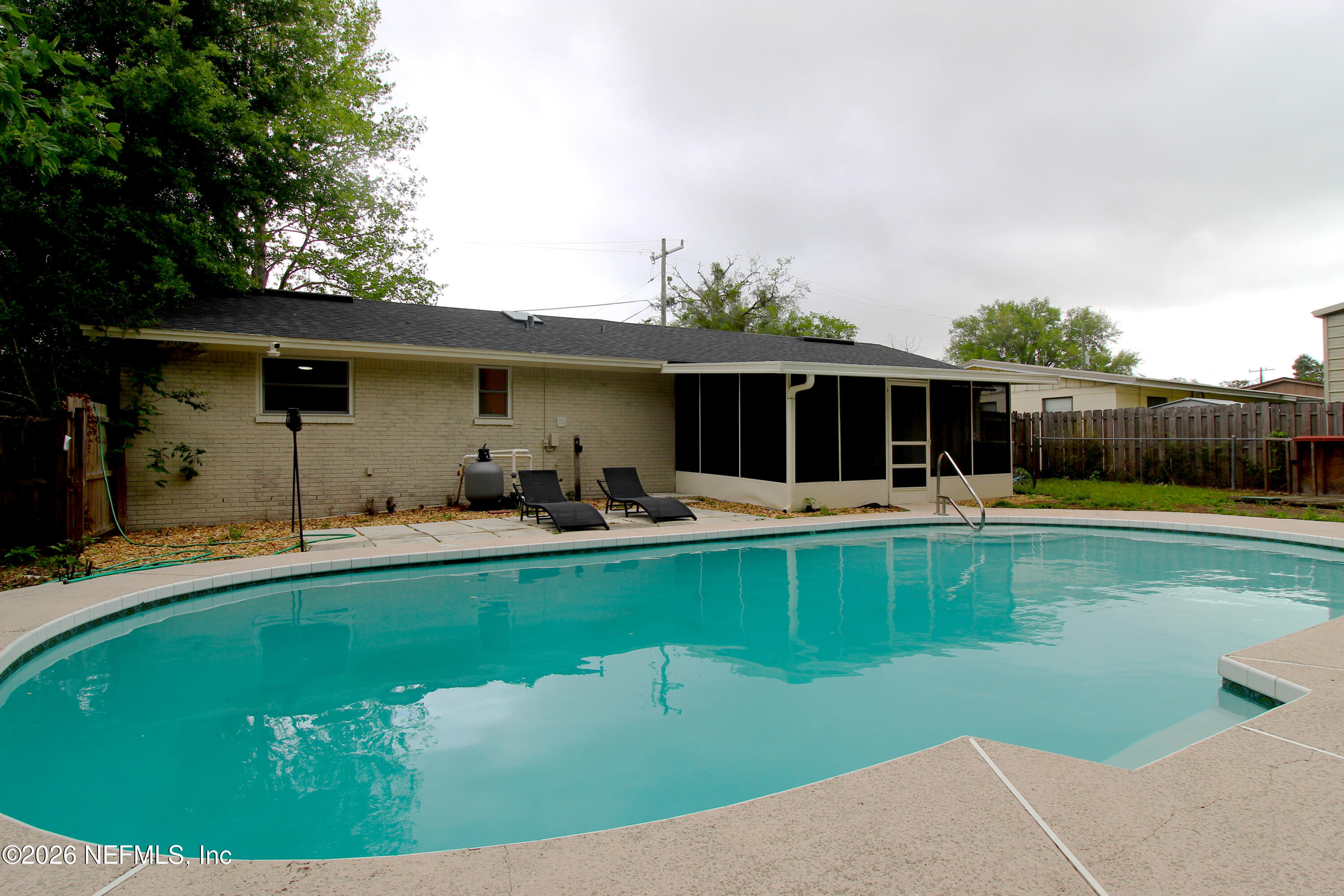 7762 Knoll Drive South Jacksonville, FL 32221 - Photo 3 of 22 a view of a house with a swimming pool